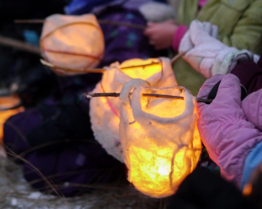 Children celebrating winter solstice outdoors